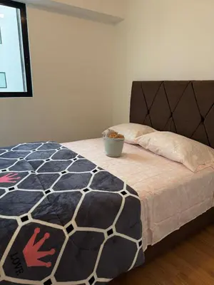 a bedroom with a bed with a bowl on it at TyB apartment in Lima