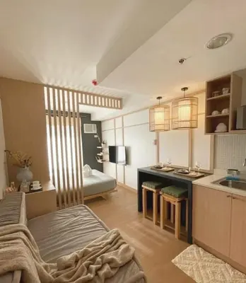 a living room with a bed and a kitchen at Mario Vera Chavez in La Molina