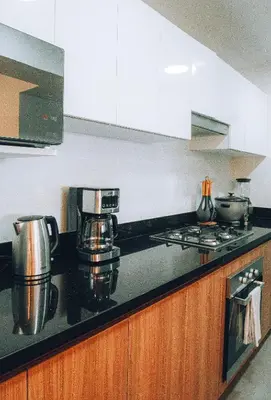 a kitchen counter with pots and pans on a stove at Luxurious Apartment in the heart of Miraflores in Lima