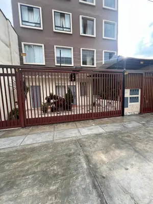 a wooden fence in front of a building at Private Whole Apartment in Surco close to Barranco in Lima