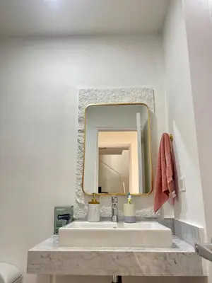 a bathroom with a sink and a mirror at LimaeStays Exclusive penthouse in downtown Barranco in Lima