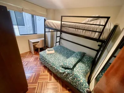 a bedroom with two bunk beds in a room at Close to the beach, Big beds, Malecon Miraflores in Lima