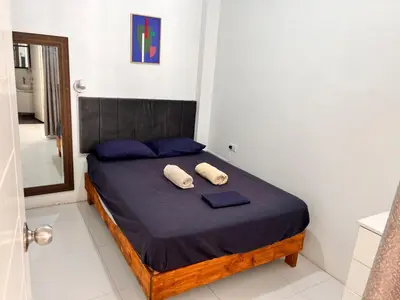 a bedroom with a bed with two pillows on it at Casa Rosé Vacacional in Santa Rosa