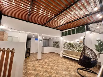 a room with a hammock in the middle of it at Casa Rosé Vacacional in Santa Rosa