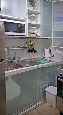 a kitchen with a sink and a microwave at Flat between Barranco, Miraflores & Surco in Lima