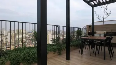 a balcony with a table and a view of a city at Eurocasas Villa Velarde in Lima