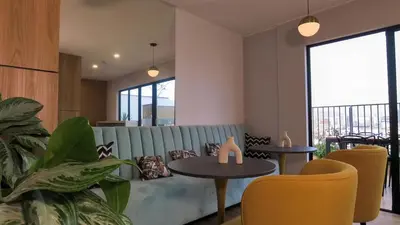 a living room with a couch and two tables and chairs at Eurocasas Villa Velarde in Lima