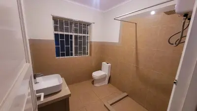 a bathroom with a toilet and a sink at Comfy Rooms in a Cozy House - Miraflores in Lima