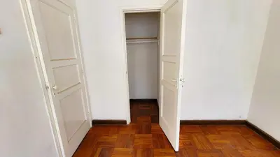 an empty closet with white walls and wooden floors at Comfy Rooms in a Cozy House - Miraflores in Lima