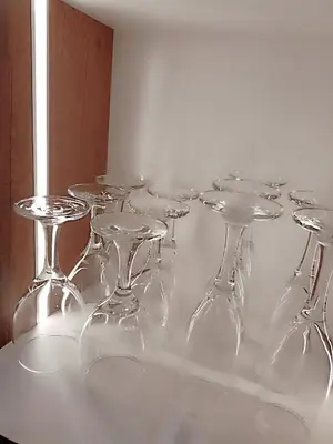 a group of wine glasses sitting on a table at Departamento amoblado y Estacionamiento Gratis in Lima
