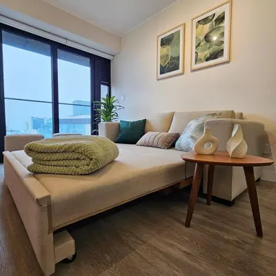a living room with a couch and a table at Modern Brand New Apartment in Miraflores in Lima