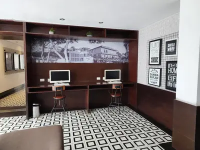 a room with two computer monitors on a wall at Departamento Osma in Lima