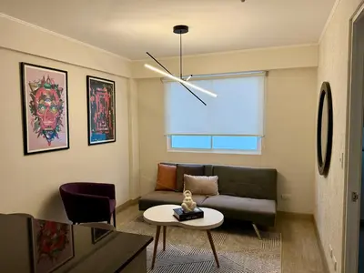 a living room with a couch and a table at Departamento Osma in Lima