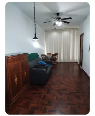 a living room with a couch and a ceiling fan at Miraflores Cozy Private Apartment with ocean view in Lima