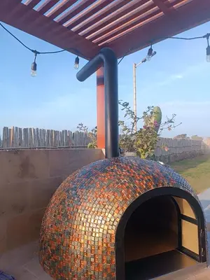 a large brick oven under a roof at Casa Campo-Playa Sand in My Shoes in Chincha