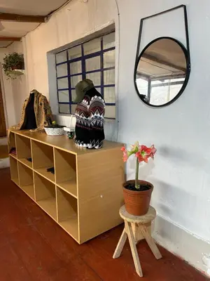 a mirror and a dresser in a room at Valentino Vent in Cusco