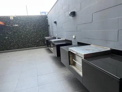 a bathroom with a row of sinks in a wall at Entire apartment minutes from Miraflores in Lima
