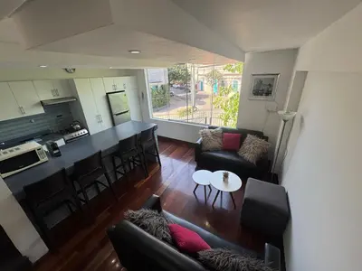 an aerial view of a living room and kitchen at Centrally located and comfortable duplex in Miraflores - Libertad1BR in Lima