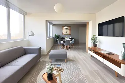 a living room with a couch and a table at The 28 Residence Miraflores in Lima