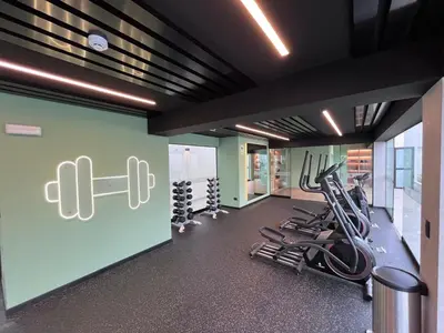 a fitness room with treadmills and cardio equipment at La Foret in Lima