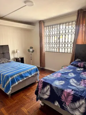 a bedroom with a bed and a window at Miraflores, habitación Triple en apartamento compartido in Lima