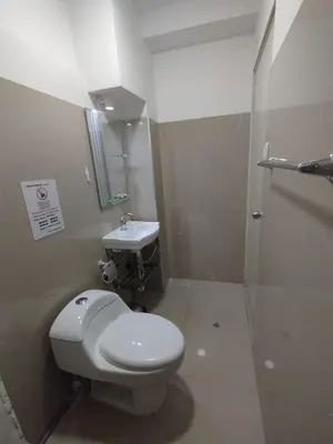 a bathroom with a toilet and a sink at Hostal San Ignacio Monterrico in Lima