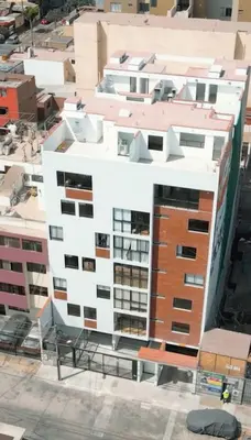 an overhead view of a large white apartment building at E Magdalena Costanera Access Wifi Pro 2B 204 in Lima