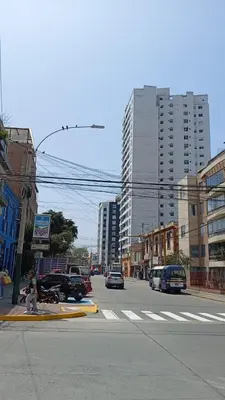 a city street with cars driving down a street with buildings at E Magdalena Costanera Access Wifi Pro 2B 204 in Lima