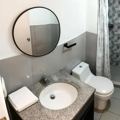 a bathroom with a sink and a mirror at E Magdalena Costanera Access Wifi Pro 2B 204 in Lima