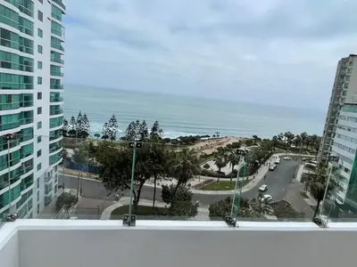 a view of the ocean from the balcony of a building at Penthouse con Vista al Mar in Lima