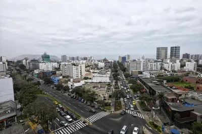 an aerial view of a city with buildings at Upper Pardo Apartments in Lima
