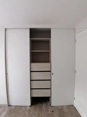 a closet with white walls and white closets at 2-Bedroom Apartment in Magdalena del Mar in Lima
