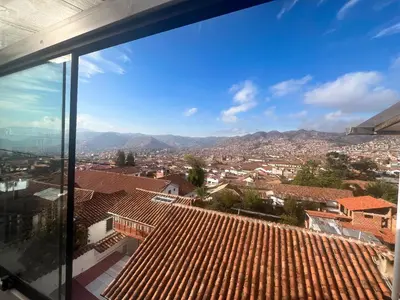 a view of a city from the roof of a building at Cusco and Rock in Cusco