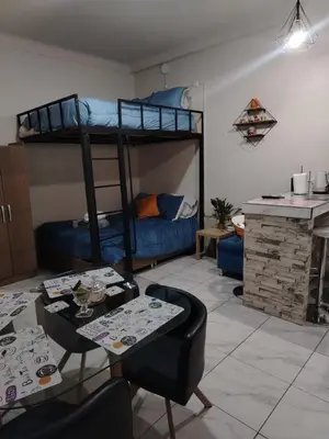 a living room with a bunk bed and a table at loft Inti in Cusco