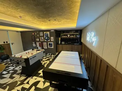 a room with a pool table and a ping pong ball at Cozy bedroom in Miraflores with rooftop pool in Lima