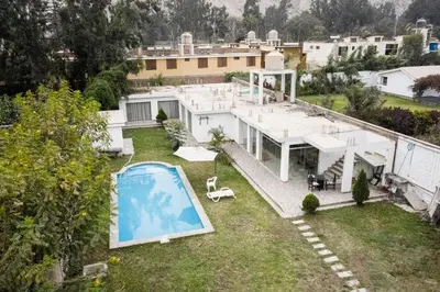 an aerial view of a house with a swimming pool at Cieneguilla Casa in Cieneguilla