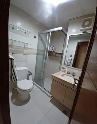 a bathroom with a toilet and a shower and a sink at los hirukus cusco in Cusco