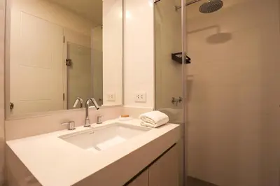 a bathroom with a sink and a mirror and a shower at Schell in Miraflores by Wynwood House in Lima