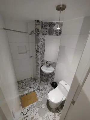 a bathroom with a toilet and a sink at Acogedora y céntrica habitación Larcomar in Lima