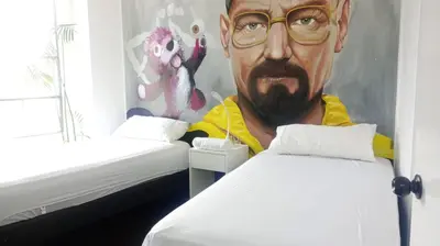 a painting of a man in a room with two beds at PintoHome in Lima