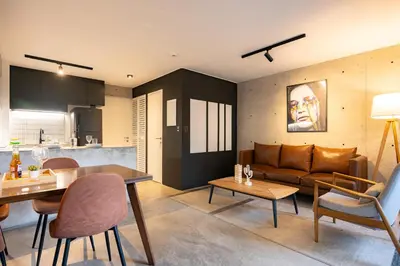 a living room with a couch and a table at MMXX Apartments by Vibrant in Lima