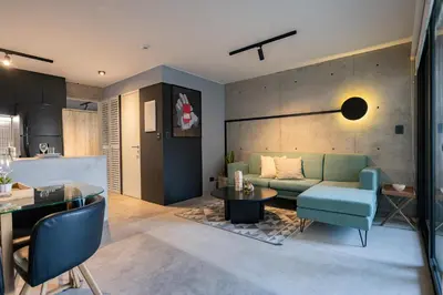 a living room with a couch and a table at MMXX Apartments by Vibrant in Lima