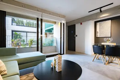 a living room with a couch and a table at MMXX Apartments by Vibrant in Lima