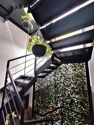 a staircase with potted plants on top of a building at Historic Quinta, Heart of Miraflores, 2 Bedroom Apartment in Lima