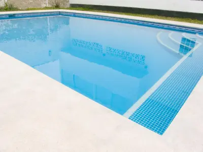 a swimming pool with a blue tile in it at Apartment with Beach Exit 204 in Punta Negra