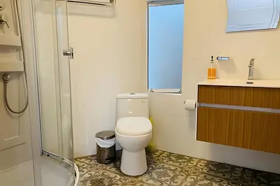 a bathroom with a toilet and a sink and a shower at Habitación Acogedora con Baño Privado y Entrada Propia en Miraflores in Lima