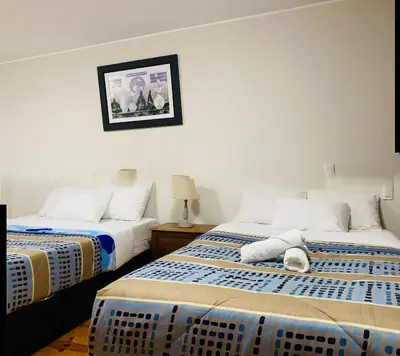 two beds sitting next to each other in a room at Suite Independiente con Baño Privado – Miraflore in Lima