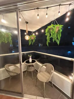 a patio with chairs and a table on a balcony at Dpto entero 2 dormitorios 2 baños máximo 5 personas in Lima