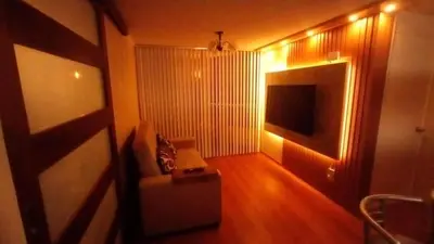 a living room with a couch and a television at Dpto entero 2 dormitorios 2 baños máximo 5 personas in Lima