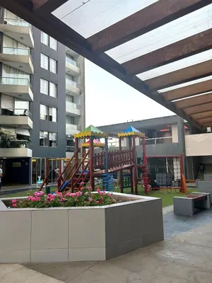a playground in a building with a playground at Dpto entero 2 dormitorios 2 baños máximo 5 personas in Lima